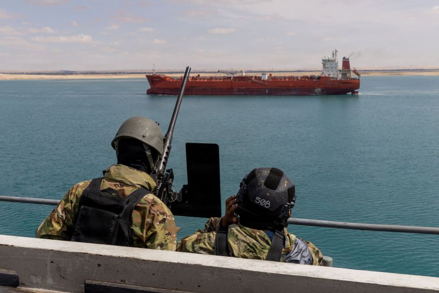 US Navy sailors stand watch on the aircraft carrier USS Gerald R. Ford as it transits the Suez Canal, en route to support the Operation Epic Fury attack on Iran on March 5.