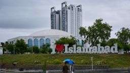 People wait for transport at a road in Islamabad, Pakistan, Wednesday, April 8, 2026.